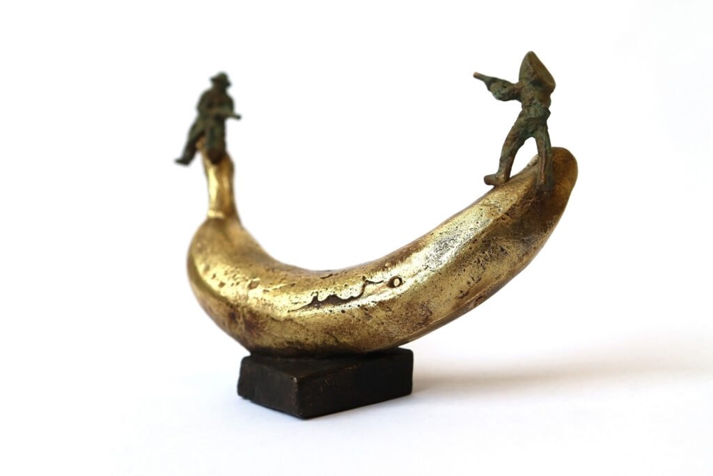 Bronze artwork by Andrew Miguel Fuller. See-saw, an absurd cowboy sculpture by AM Andy Fuller