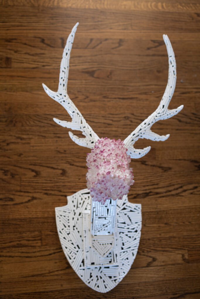 Trophy is a resin crystal and metal sculpture by Andrew Miguel Fuller. Mounted stag artwork by AM Fuller.
