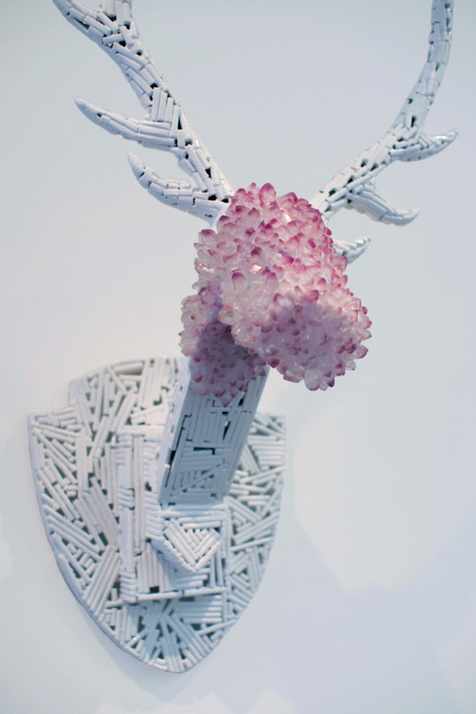 Trophy is a resin crystal and metal sculpture by Andrew Miguel Fuller. Mounted stag artwork by AM Fuller.