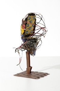 Catya II sculpture by AM Andy Fuller, Andrew Miguel Fuller. Assemblage art, bottle cap artwork with hammered copper