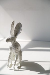 All white rabbits are made of porcelain. Powder coated metal sculpture by AM Fuller. Andrew Miguel Fuller contemporary fine art