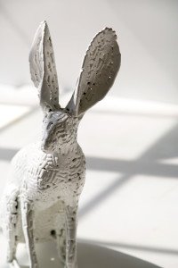 All white rabbits are made of porcelain. Powder coated metal sculpture by AM Fuller. Andrew Miguel Fuller contemporary fine art