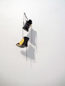 Out with the new! - Fine art sculpture by Andrew Miguel Fuller - Assemblage artwork by Andy Fuller - vinyl records, shoe laces. Installation view at Mercury Twenty Gallery in Oakland, CA