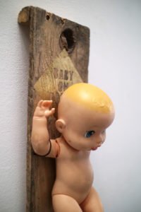 Baby on board, an assemblage art sculpture by Andrew Miguel Fuller. Found object artwork by Andy AM Fuller