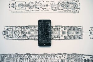 RMS Titanic and iPhone is an assemblage sculpture by AM Fuller. Drawing and sculpture by Andrew Miguel Fuller.